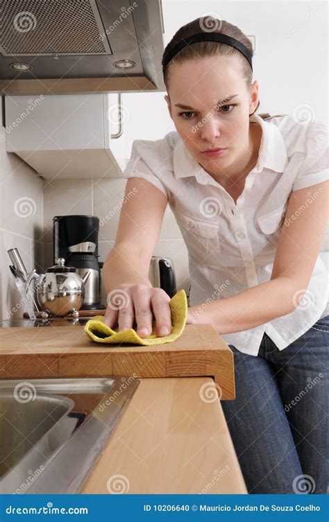 Woman cleaning the kitchen stock photo. Image of hold - 10206640