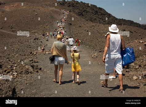 Guided tour on Santorini volcano Stock Photo - Alamy