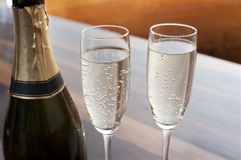 Two elegant flutes of sparkling champagne - Free Stock Image