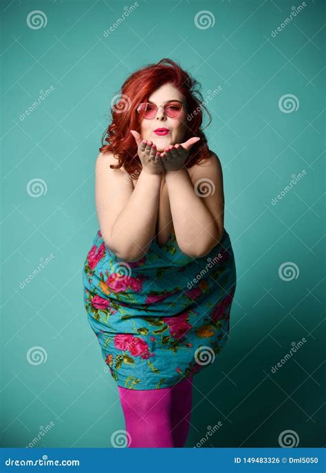 Plus-size Overweight Redhead Lady in Fashion Sunglasses Send a Kiss on Mint Stock Photo - Image ...