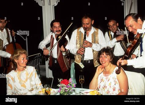 Budapest, Hungary. Traditional Hungarian gypsy band playing for guests at a restaurant; violin ...