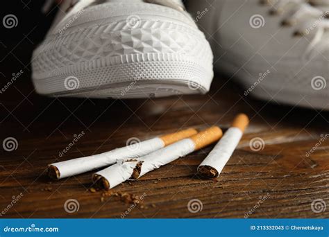 Woman Stepping on Pile of Cigarettes, Closeup. Quitting Smoking Concept Stock Image - Image of ...