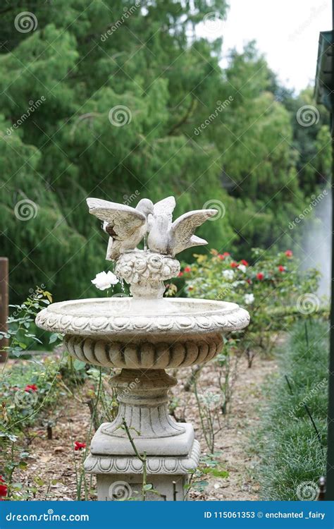 Vintage Fountain. Beautiful Vintage Fountain in a Garden with Lo Stock ...