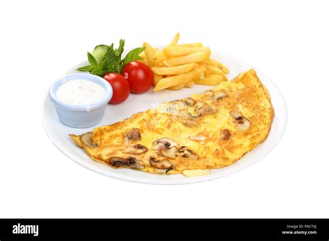 Breakfast omelette with french fries and garnish Stock Photo - Alamy