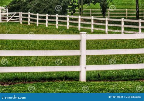 White Fence Outlining Farmland Stock Image - Image of farm, fence ...