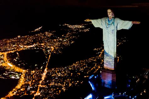 Rio's Christ the Redeemer statue lit up as a doctor, in tribute to healthcare workers fighting ...