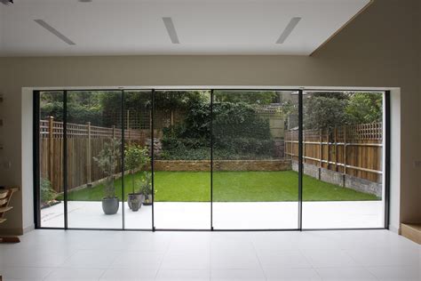 Bi parting minimal windows used as modern patio doors in London by IQ ...