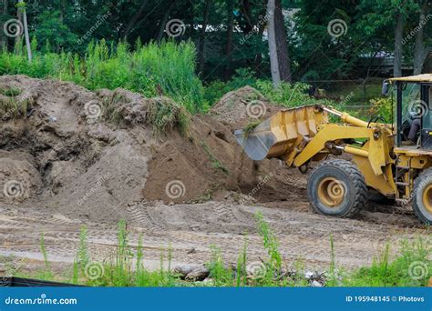 Backhoe Digging the Ground during Works at for Soil Construction Stock ...