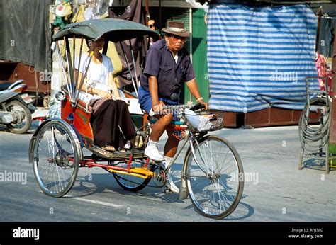 Bicycle rickshaw driver and passenger, Chiang Mai, Thailand Stock Photo - Alamy