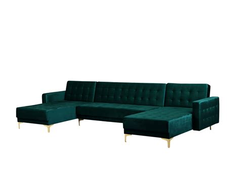 a blue sectional sofa with gold legs