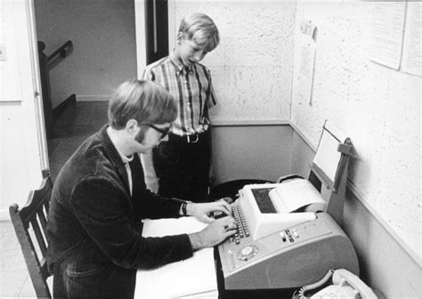 Paul Allen with Bill Gates in front of a teletype machine at the ...