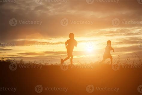 silhouette of a happy children and happy time sunset 7965144 Stock ...