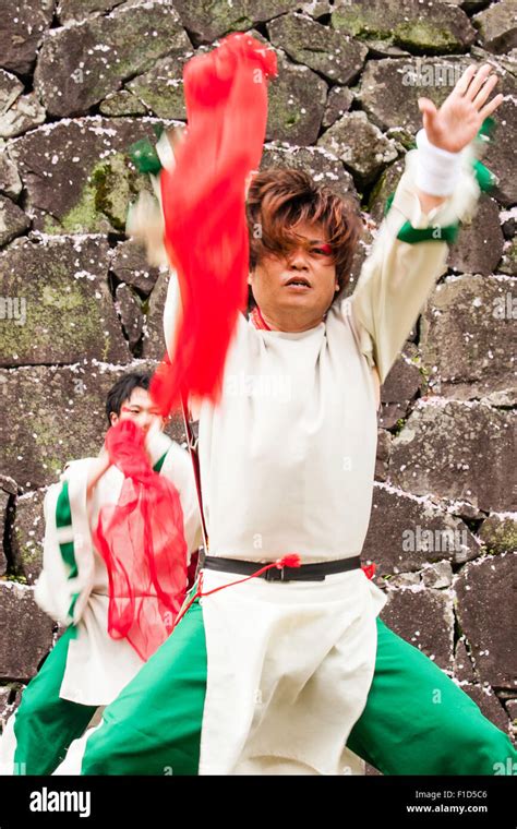 Japanese Yosakoi dance team. Dancers wearing white and green costumes ...