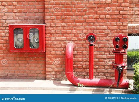 Fire Hydrant,hose and Pipes Inserted on Brick Wall Stock Photo - Image of inserted, hydrant ...