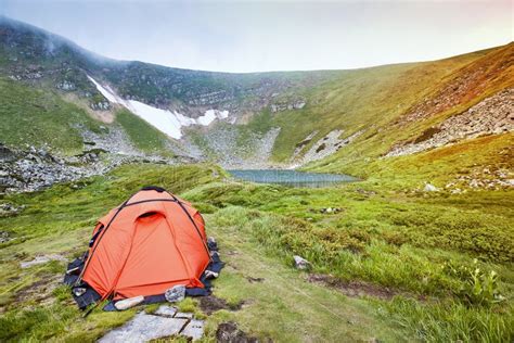 Camping with a Tent Near a Mountain Lake in the Mountains Stock Photo ...