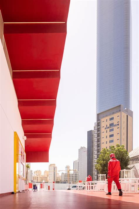 stepped canopy colored in bright red and white emerges in kuwait