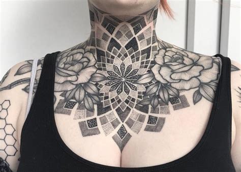 a woman with tattoos on her neck and chest