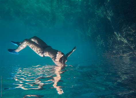 "Underwater People Swimming In The Sea" by Stocksy Contributor "Blue Collectors" - Stocksy