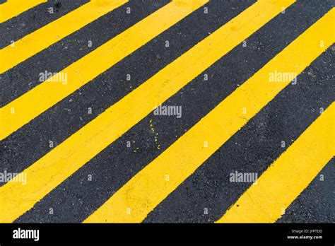 Asphalt Background with diagonal black and yellow warning stripes Stock Photo: 147404921 - Alamy