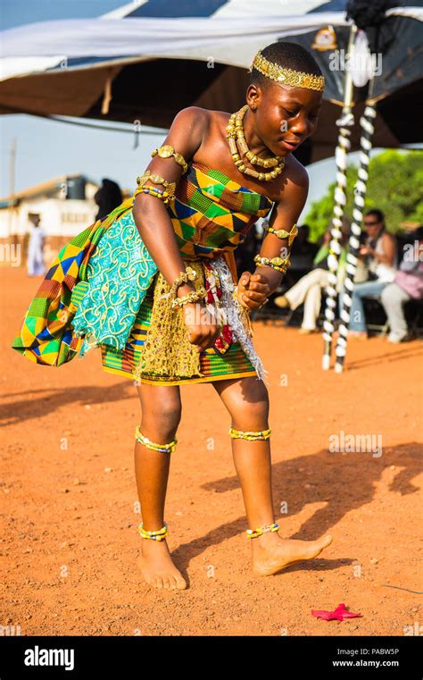 GHANA - MARCH 3, 2012: Ghanaian girl in national colors clothes dances ...