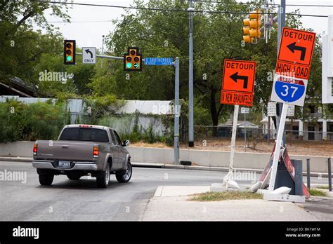 Vehicle at road junction with detour signs and traffic lights San Antonio Texas USA Stock Photo ...