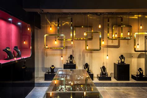 Rain of Gold: Stunning Jewelry Store Enchants in Breathtaking Black and Gold | Decoist