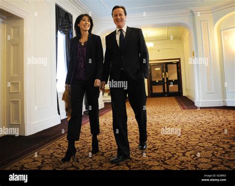 Conservative Party leader David Cameron arrives with his wife Samantha ...