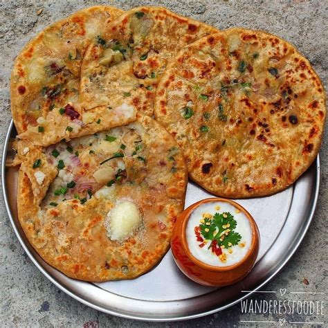 foodlover on Instagram: “aloo paratha loaded with desi ghee alone with some raita is a pure ...