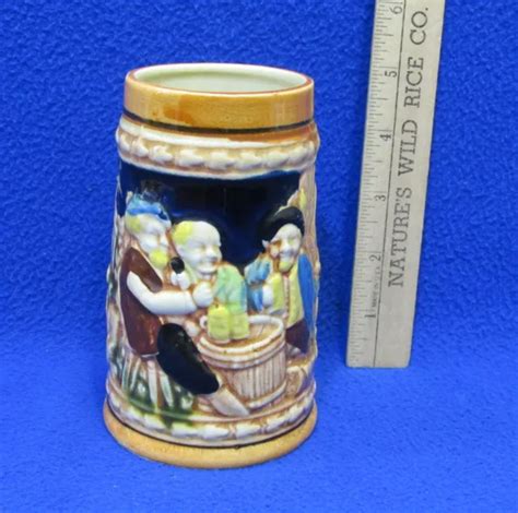 BEER STEIN MUG Cup w/ Relief Men Drinking Barrel Table Textured Ceramic ...