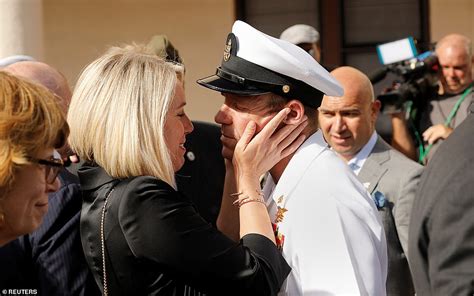 Navy SEAL Eddie Gallagher drives embraces his emotional children as he celebrates being cleared ...