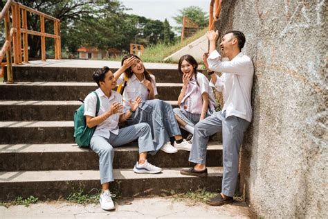 Four High School Students in Uniforms Joking with Their Friends Stock Image - Image of enjoy ...