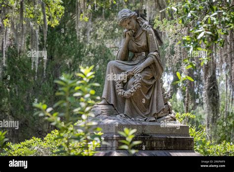 Historic Bonaventure Cemetery memorial amidst Southern live oaks and Spanish moss in Savannah ...