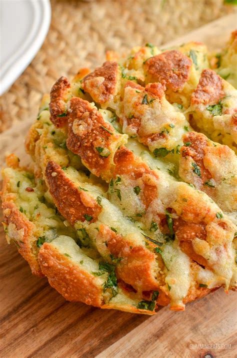 melted cheese on syn free pull-apart cheesy garlic bread on board with plate | Recipes, Easy ...