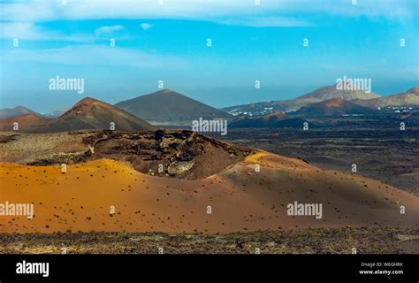 Volcanic landscape and volcano crater at Timanfaya National Park, Lanzarote Island, Canary Spain ...