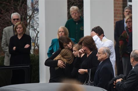 People Crying At A Funeral