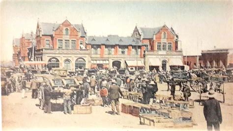 an old photo of people in front of a building