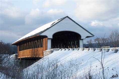 Snow Covered Wooden Covered Bridge Illuminated By Late Afternoon - Axis Medical Staffing