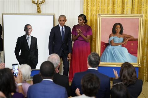 Obama embraces Biden during official White House portrait unveiling ...