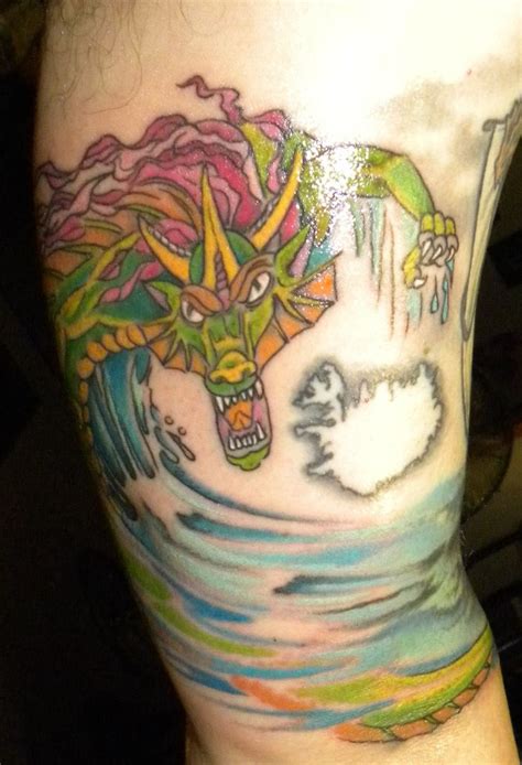 17th Tattoo: Multicolored Sea Serpent wrapped around upper left arm ...