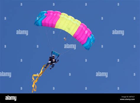 A sky diver with a colorful parachute Stock Photo - Alamy