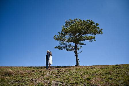 Royalty-Free photo: Silhouette of man and woman near body of water ...