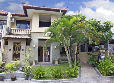 a house that has some plants in front of it