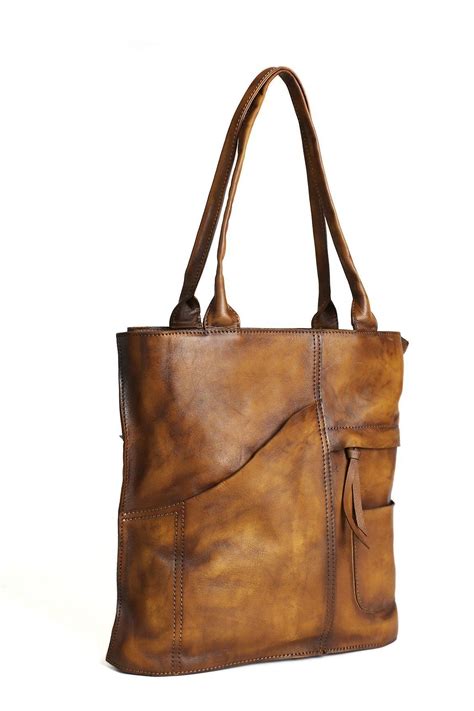 This bag is made of superior full grain cowhide leather, which the leather is very beautiful and ...