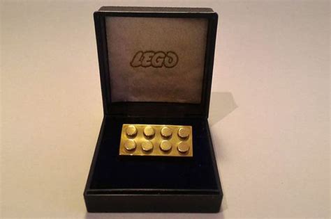 Lego brick made of 14 carat solid gold sells for £12,000 - World News - Mirror Online