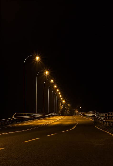 HD wallpaper: empty highway under lighted lamp posts at night time, alder stream bridge ...