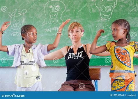 White Caucasian Woman Teaching Black Children in Africa Editorial Stock Photo - Image of ...