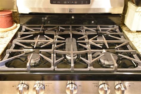 Magically Wipe Your Stove Top Burner Grates Clean with No Scrubbing! | Clean stove top, Clean ...