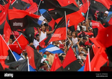 People wave Sandinista flags at a rally marking the 29th anniversary of ...