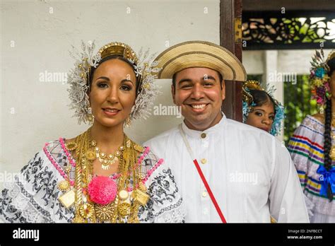 A Panamanian man and woman in traditional dress. The woman wears a ...