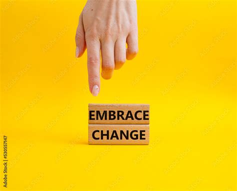 Embrace change symbol. Concept word Embrace change on wooden blocks ...